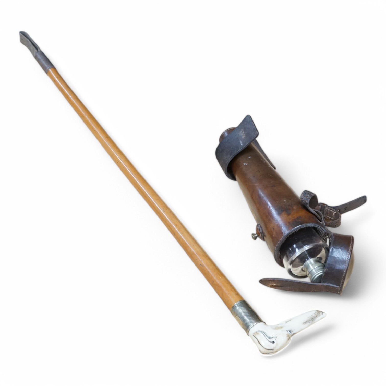A riding crop with carved stag antler dog’s head handle together with a leather cased riding flask, 79cm. Condition - fair to good